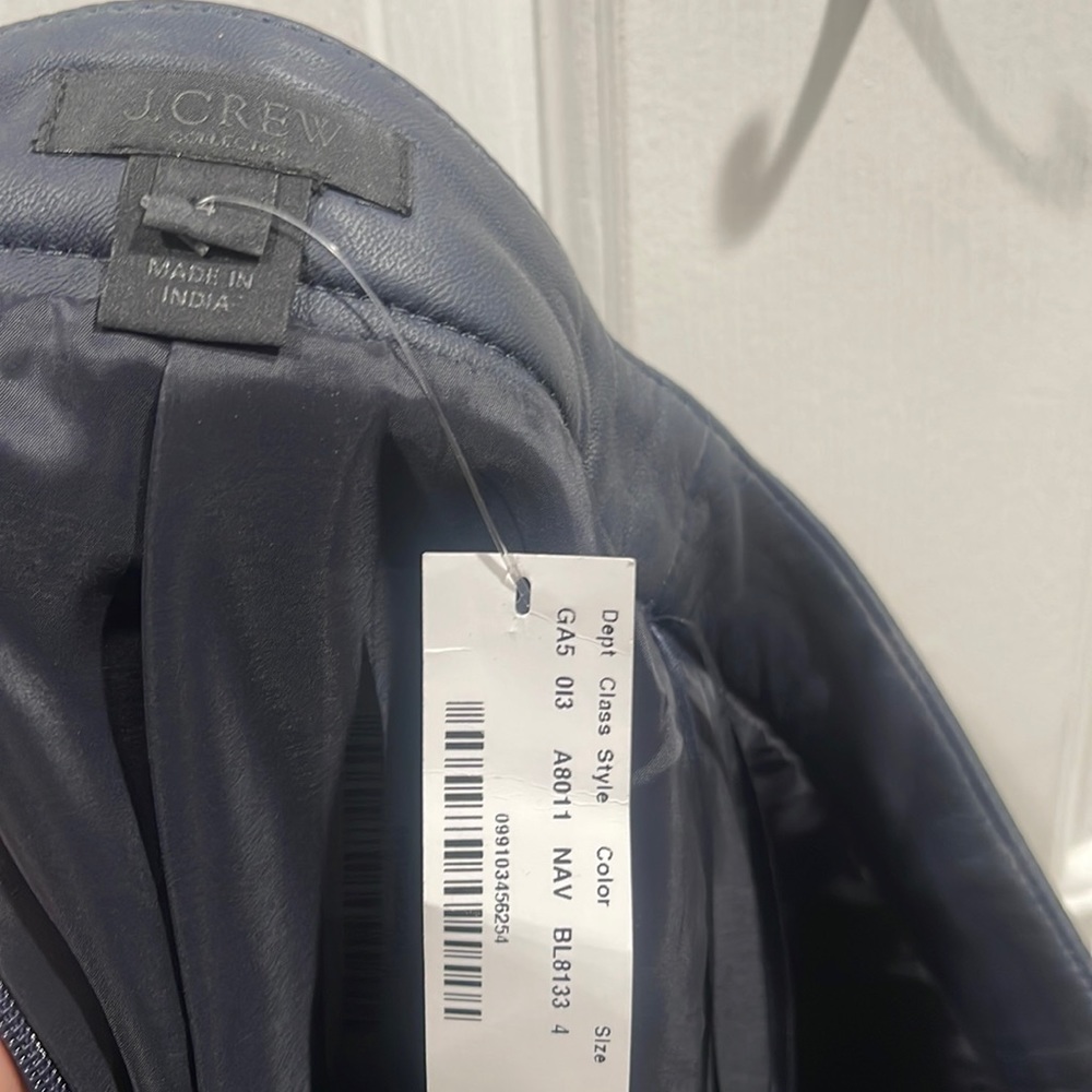 J Crew navy leather mini skirt. Never worn, still has tags. Size 4.